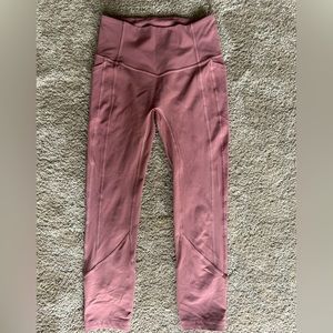 Lululemon pink workout leggings size medium.